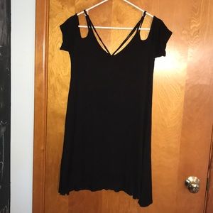 Black dress with shoulder cutouts and straps